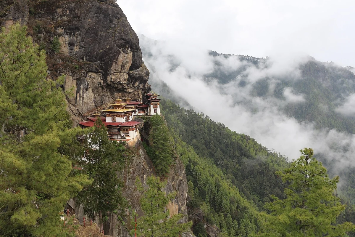 Taktsang, the Tiger’s Nest monastery, on its cliff above the Paro valley as the mist rises